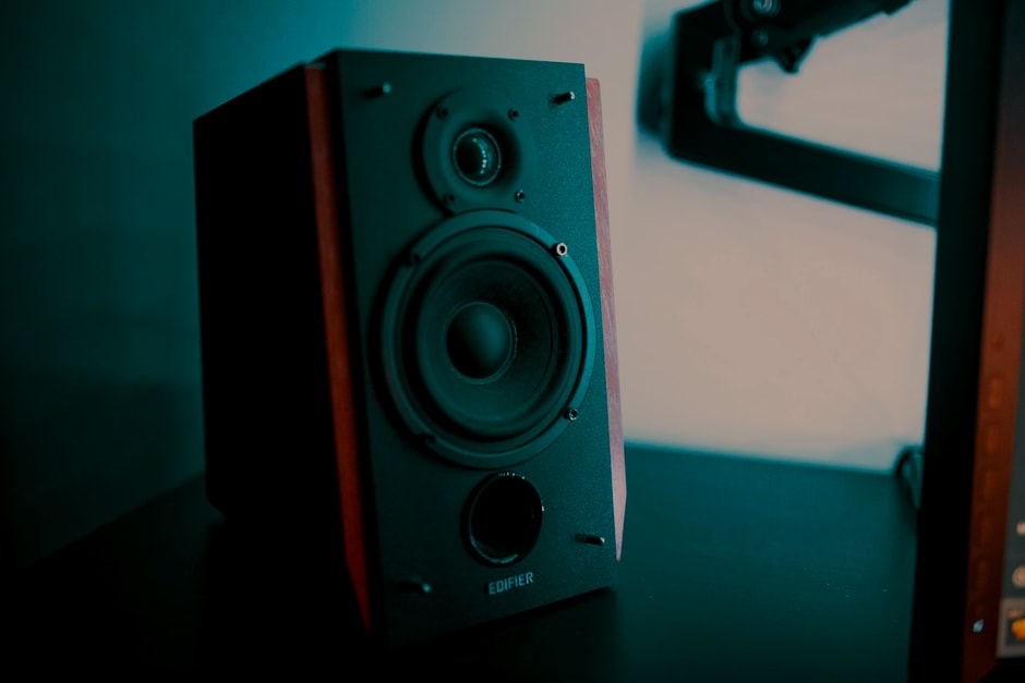 Real compact speaker photo with low ambient light